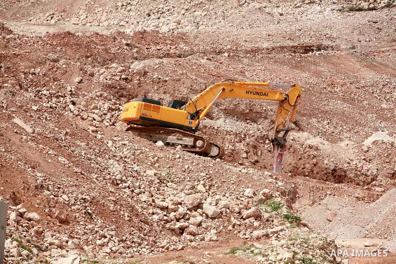 Israeli bulldozers work in the jewish settlement of Pisgat Zeev in East Jerusalem, Tuesday, April 5, 2011. A group of prominent Israelis is presenting an informal new peace proposal, hoping to breathe life into deadlocke...