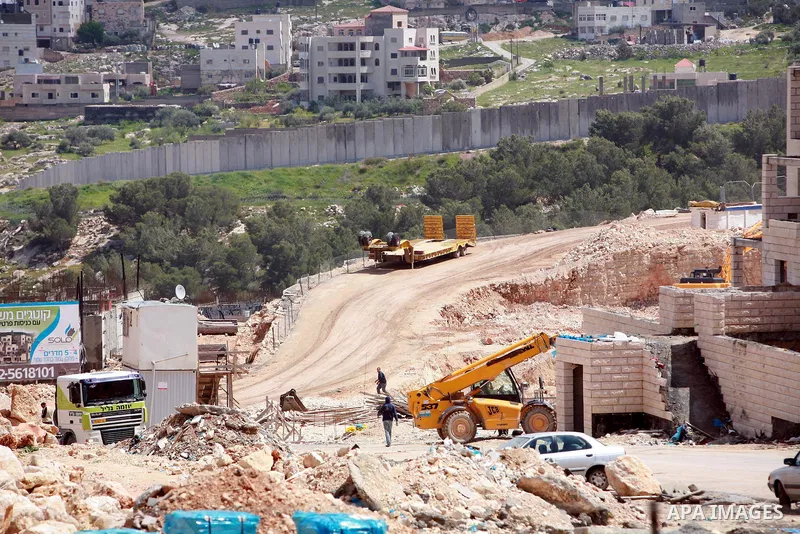 Israeli bulldozers work in the jewish settlement of Pisgat Zeev in East Jerusalem, Tuesday, April 5, 2011. A group of prominent Israelis is presenting an informal new peace proposal, hoping to breathe life into deadlocke...