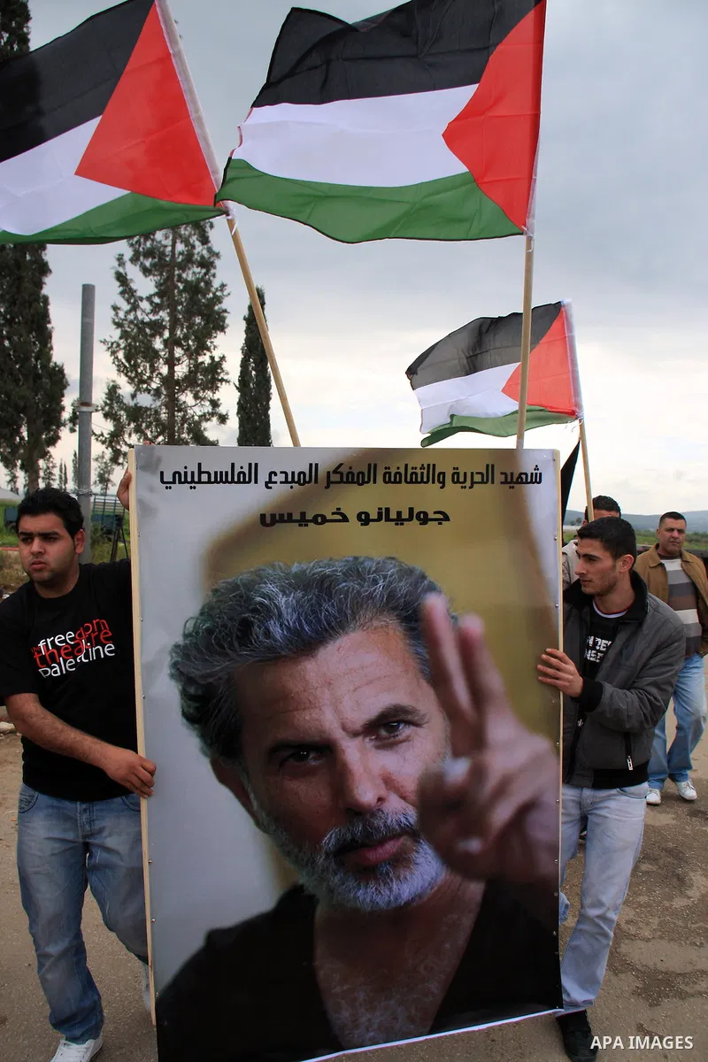 Palestinian Students of Jenin's Freedom Theater weep while waiting for the body of Arab-Israeli actor and director Juliano Mer-Khamis during his funeral at al Jalama Israeli checkpoint between Hayfa City and the West Ban...