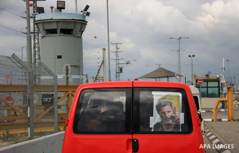 Palestinian Students of Jenin's Freedom Theater weep while waiting for the body of Arab-Israeli actor and director Juliano Mer-Khamis during his funeral at al Jalama Israeli checkpoint between Hayfa City and the West Ban...