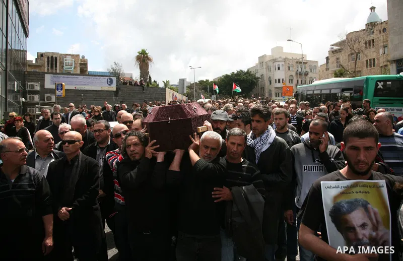 People carry the coffin of Arab-Israeli actor and director Juliano Mer Khamis during a funeral procession near al-Midan theater in the northern Israeli city of Haifa April 6, 2011. Mer-Khamis was gunned down Monday in th...