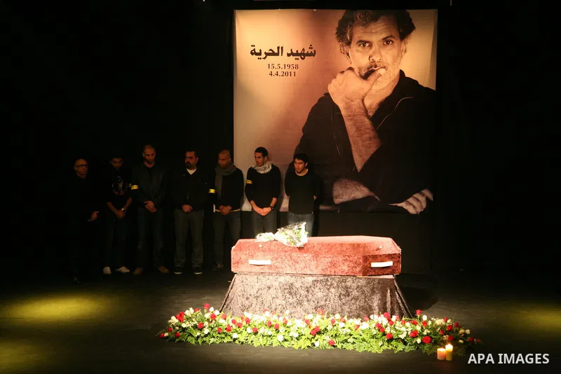 Mourners react as they gather around the coffin of Israeli Palestinian actor, director, filmmaker and political activist Juliano Mer-Khamis, who was shot dead in the West Bank refugee camp of Jenin on Monday, during his...