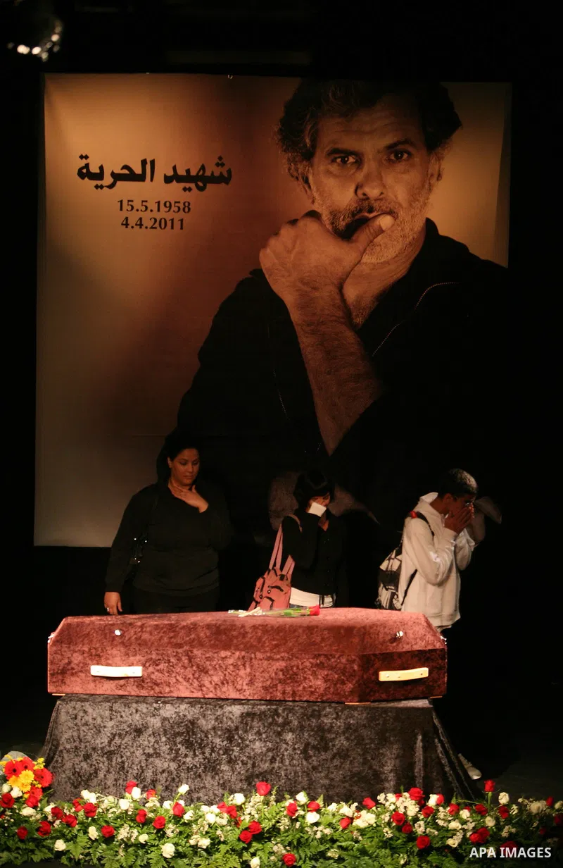 Mourners react as they gather around the coffin of Israeli Palestinian actor, director, filmmaker and political activist Juliano Mer-Khamis, who was shot dead in the West Bank refugee camp of Jenin on Monday, during his...