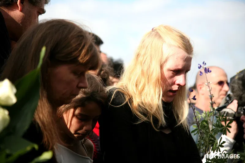 The wife of Arab-Jewish actor and theatre director Juliano Mer-Khamis is cheered up by a relative during her husbands' funeral procession in Haifa, northern Israel, Wednesday, April 6, 2011. Mer-Khamis was gunned down Mo...