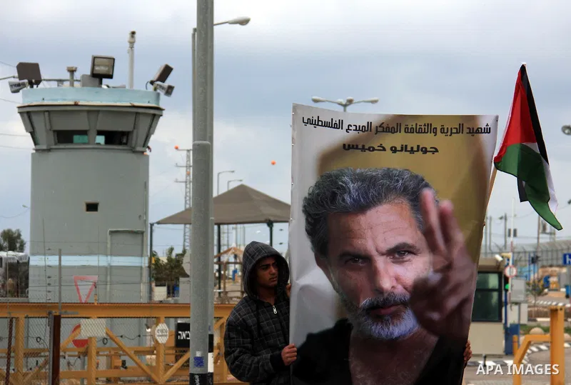A Palestinian man waits for the arrival of the coffin of Israeli Palestinian actor, director, filmmaker and political activist Juliano Mer-Khamis, who was shot dead in the West Bank refugee camp of Jenin on Monday, durin...