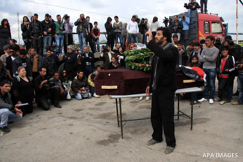 Palestinians carry the coffin of Israeli Palestinian actor, director, filmmaker and political activist Juliano Mer-Khamis, who was shot dead in the West Bank refugee camp of Jenin on Monday, during his funeral procession...