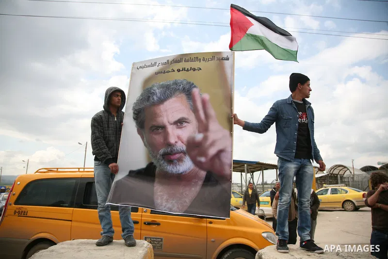 A Palestinian man waits for the arrival of the coffin of Israeli Palestinian actor, director, filmmaker and political activist Juliano Mer-Khamis, who was shot dead in the West Bank refugee camp of Jenin on Monday, durin...