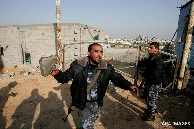 Palestinian security forces inspect bombed Hamas police training camp in Beit Lahia on April 7, 2011 after Israeli troops shelled two separate areas in Gaza, killing one person and wounded at least 10. Photo by Mohammed...