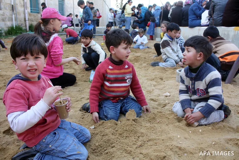Palestinian children take part in playing festival ( All Together with Children) at Child Happiness Center in the West Bank city of Hebron,on April 07, 2011.Photo by Najeh Hashlamoun