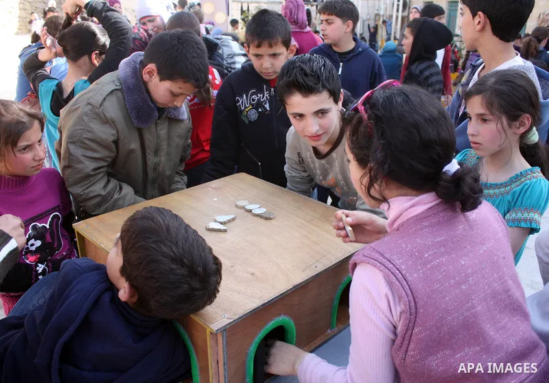 Palestinian children take part in playing festival ( All Together with Children) at Child Happiness Center in the West Bank city of Hebron,on April 07, 2011.Photo by Najeh Hashlamoun