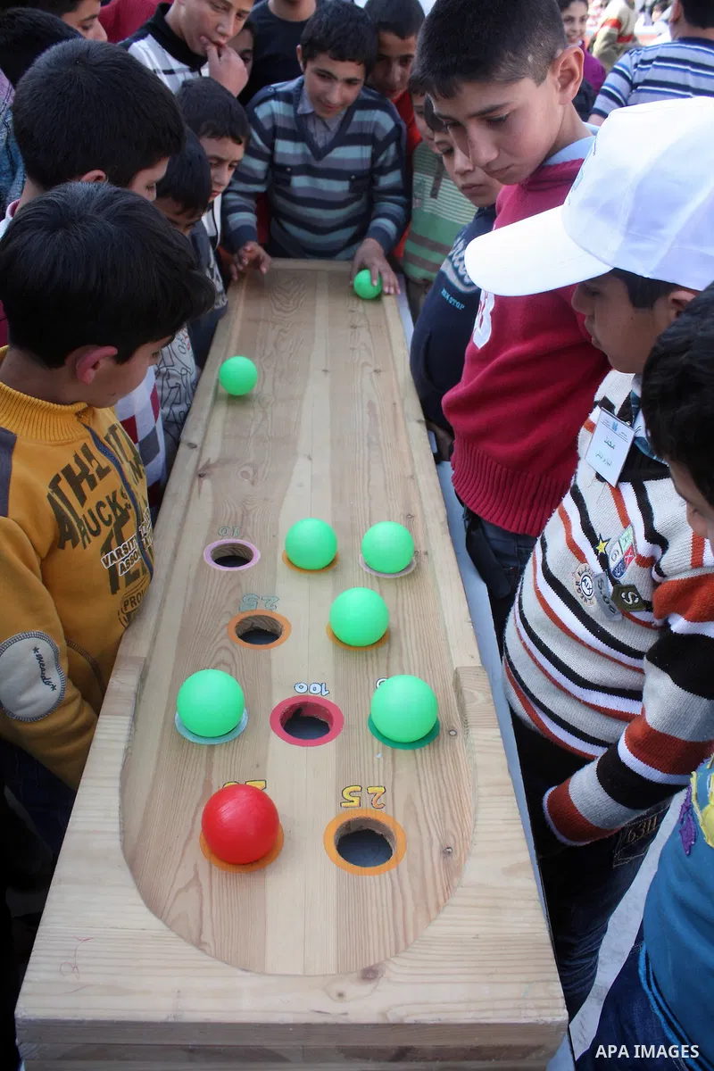 Palestinian children take part in playing festival ( All Together with Children) at Child Happiness Center in the West Bank city of Hebron,on April 07, 2011.Photo by Najeh Hashlamoun