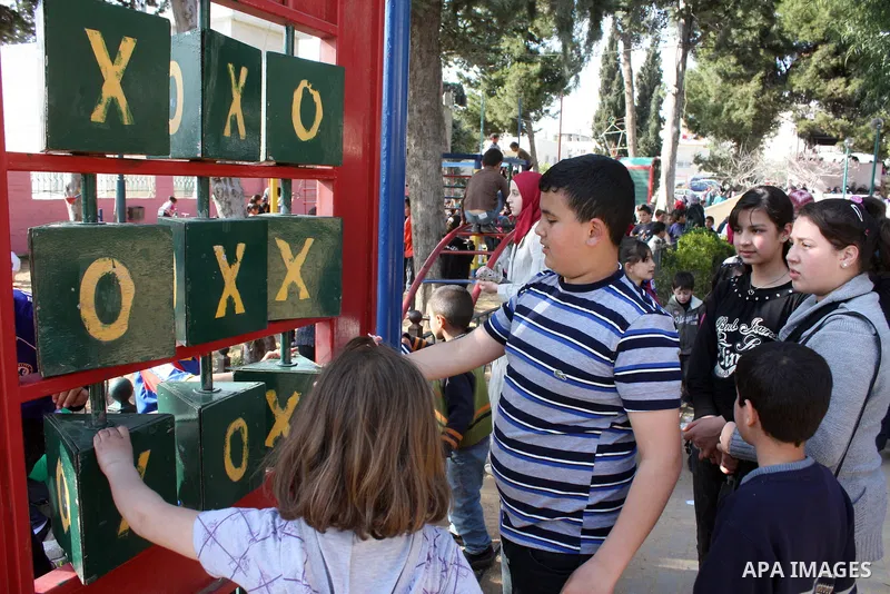 Palestinian children take part in playing festival ( All Together with Children) at Child Happiness Center in the West Bank city of Hebron,on April 07, 2011.Photo by Najeh Hashlamoun