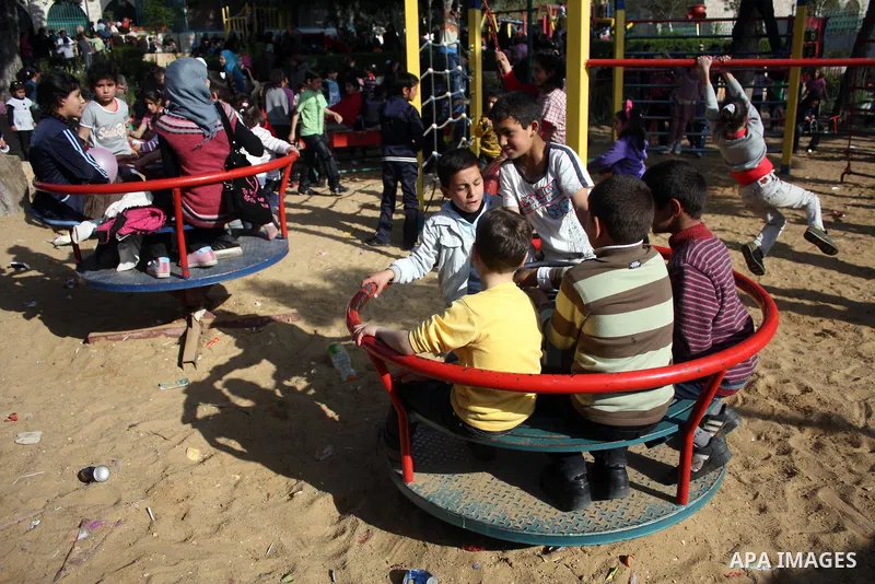 Palestinian children take part in playing festival ( All Together with Children) at Child Happiness Center in the West Bank city of Hebron,on April 07, 2011.Photo by Najeh Hashlamoun