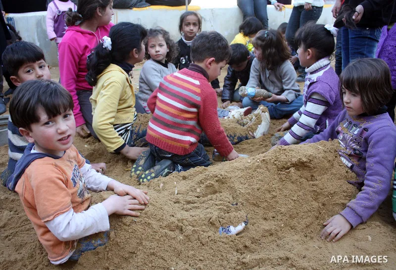 Palestinian children take part in playing festival ( All Together with Children) at Child Happiness Center in the West Bank city of Hebron,on April 07, 2011.Photo by Najeh Hashlamoun