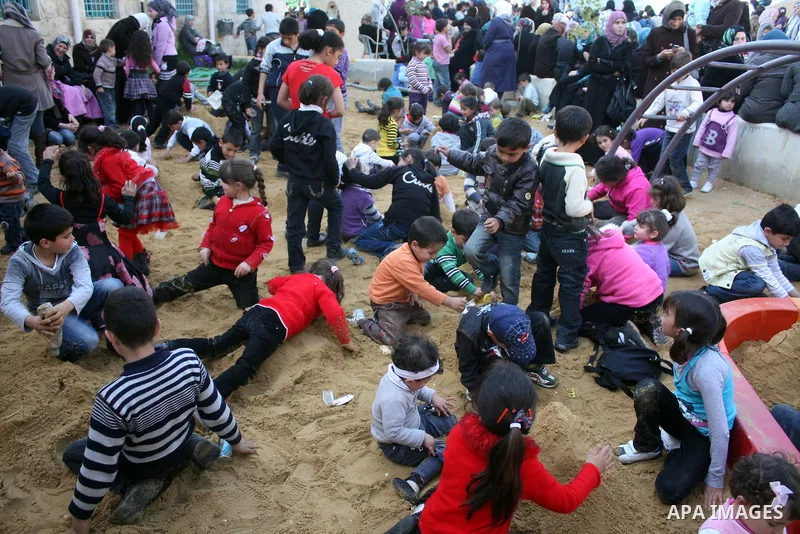 Palestinian children take part in playing festival ( All Together with Children) at Child Happiness Center in the West Bank city of Hebron,on April 07, 2011.Photo by Najeh Hashlamoun