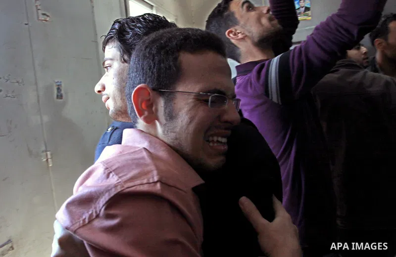 Palestinian mourn their relative who killed by Israeli shell at a morgue in al-Shifa hospital in Gaza city, April 7, 2011. After a Palestinian mortar shell from the Gaza Strip struck a school bus in southern Israel Thurs...