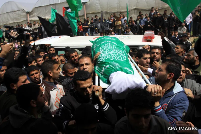 Palestinian mourners carry the body of Motaz Abu Jameh during his funeral in the southern Gaza Strip town of Khan Yunis on April 8, 2011 after Israeli warplanes pounded the coastal strip, killing at least three civilians...