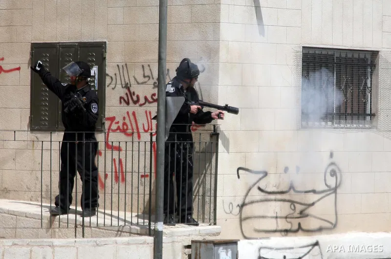 Israeli soldiers fire tear gas canisters towards Palestinian demonstrators during the clashes after Friday prayers in Jerusalem's neighbourhood of Silwan on April 08, 2011. Photo by Sliman Khader