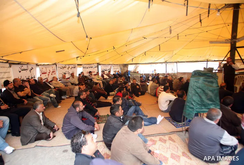 Palestinian demonstrators attend Friday prayers at the protest tent in Jerusalem's neighbourhood of silwan on April 08, 2011. Photo by Sliman Khader