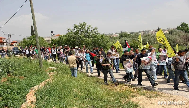Palestinian protestors take part in the weekly demonstration against Israel's separation barrier in the West Bank village of Bilin, near Ramallah, Friday, April 8, 2011. Israel says the barrier is necessary for security...