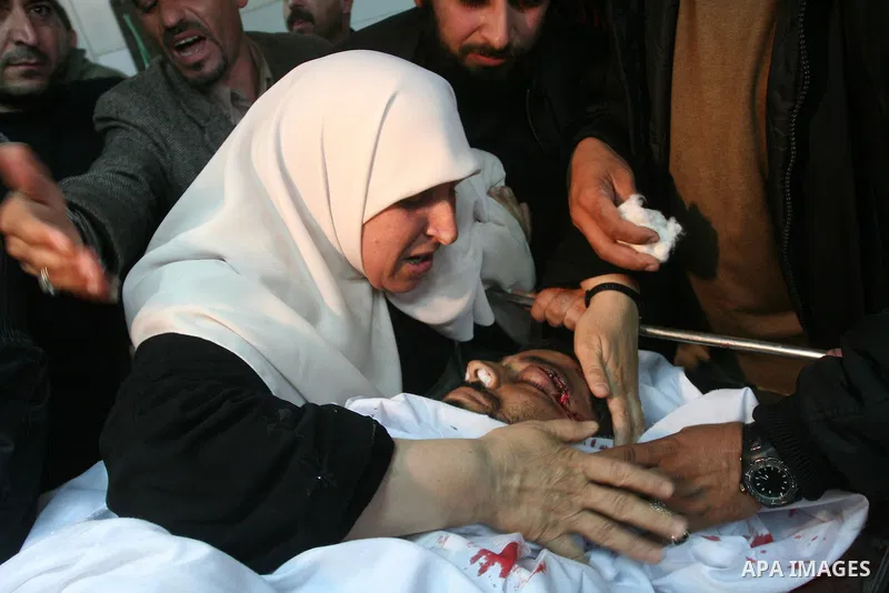 Palestinian relatives of the militant Raed Shehada weep in a hospital in Gaza City on April 8, 2011 after he was killed in an Israeli air strike on northern Gaza, a spokesman for the Palestinian emergency services. Photo...