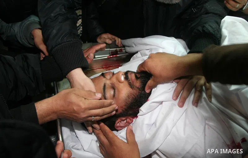Palestinian relatives of the militant Raed Shehada weep in a hospital in Gaza City on April 8, 2011 after he was killed in an Israeli air strike on northern Gaza, a spokesman for the Palestinian emergency services. Photo...