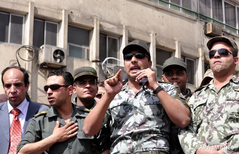 Egyptian officers take part in a protest calling the Field Marshal Hussein Tantawi to step down in Cairo's central Tahrir Square, the focal point of Egyptian uprising, during a protest demanding prosecution of Mubarak an...