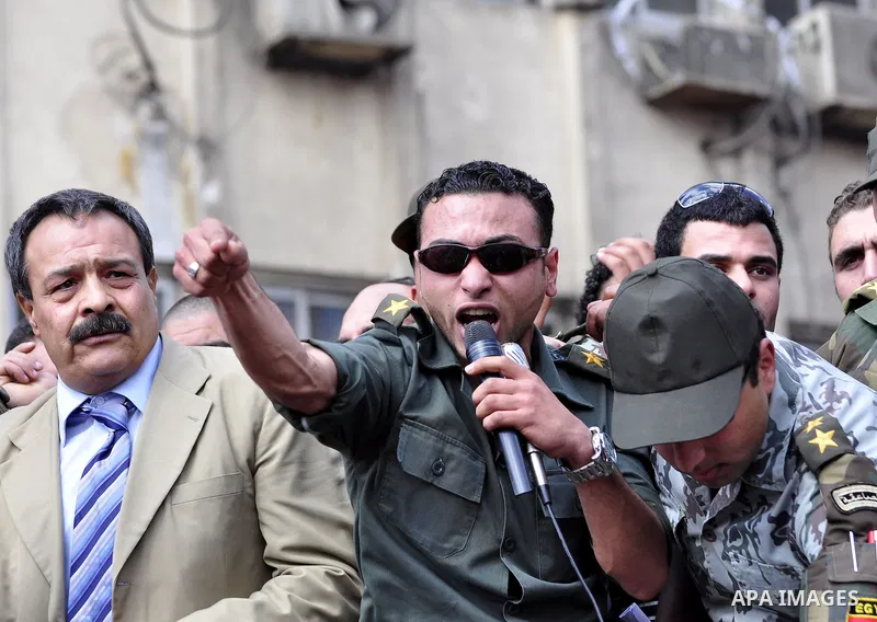 Egyptian officers take part in a protest calling the Field Marshal Hussein Tantawi to step down in Cairo's central Tahrir Square, the focal point of Egyptian uprising, during a protest demanding prosecution of Mubarak an...