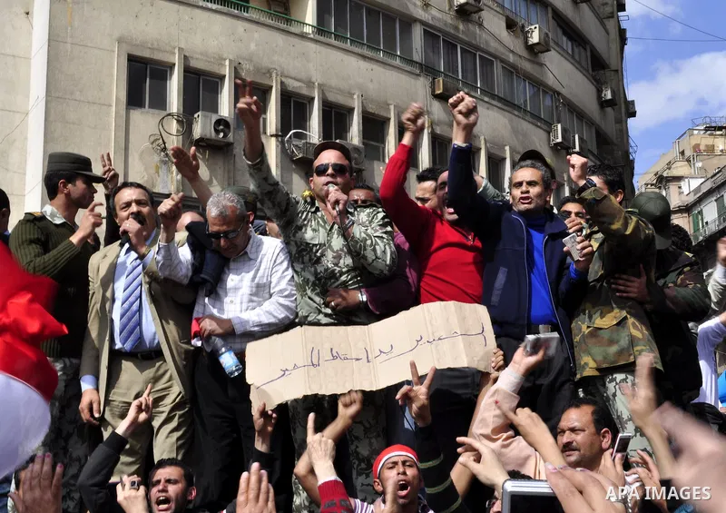 Egyptian officers take part in a protest calling the Field Marshal Hussein Tantawi to step down in Cairo's central Tahrir Square, the focal point of Egyptian uprising, during a protest demanding prosecution of Mubarak an...