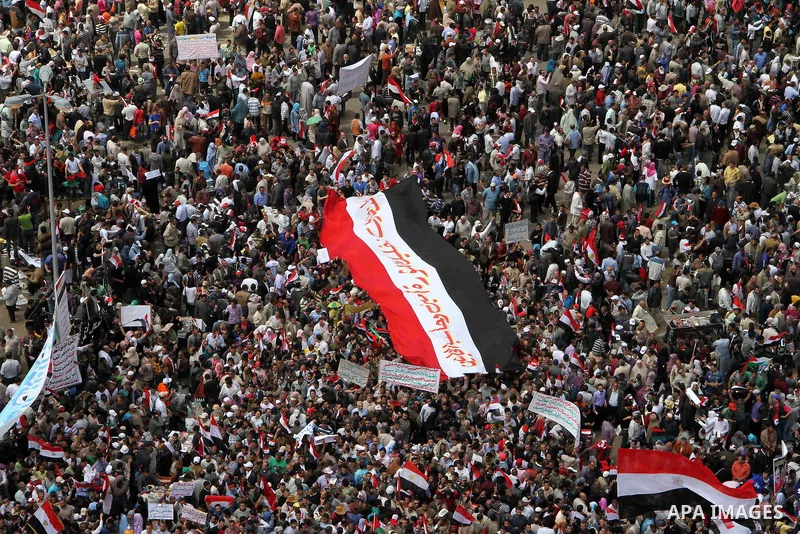 Egyptians perform Friday prayers as tens of thousands gathered for a demonstration at Cairo's Tahrir Square on April 8, 2011, two months after president Hosni Mubarak was ousted, to demand that former regime officials in...