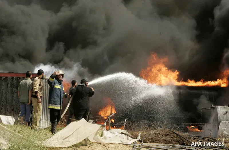 Palestinians try to extinguish an accidental fire that swept over a smuggling tunnel in the southern Gaza Strip town of Rafah on the border with Egypt on April 8, 2011. Tunnels under the town of Rafah that straddles the...
