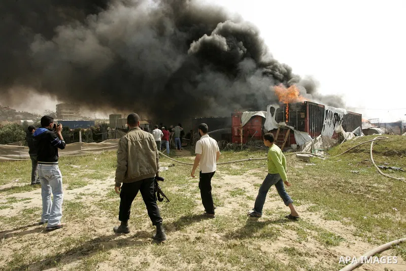 Palestinians try to extinguish an accidental fire that swept over a smuggling tunnel in the southern Gaza Strip town of Rafah on the border with Egypt on April 8, 2011. Tunnels under the town of Rafah that straddles the...