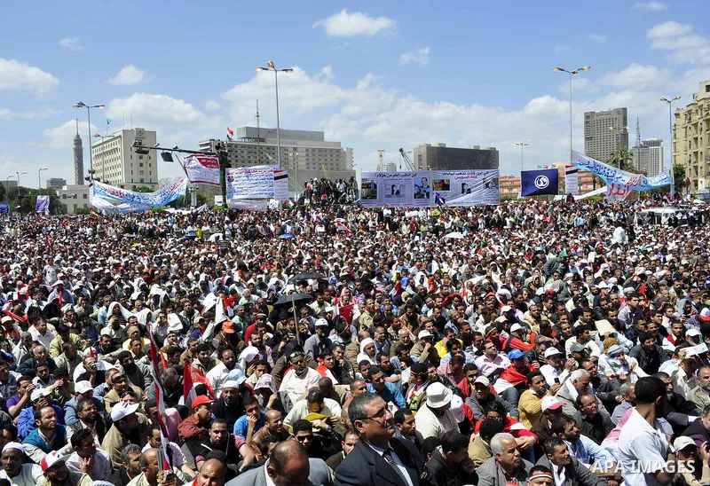 Egyptians perform Friday prayers as tens of thousands gathered for a demonstration at Cairo's Tahrir Square on April 8, 2011, two months after president Hosni Mubarak was ousted, to demand that former regime officials in...