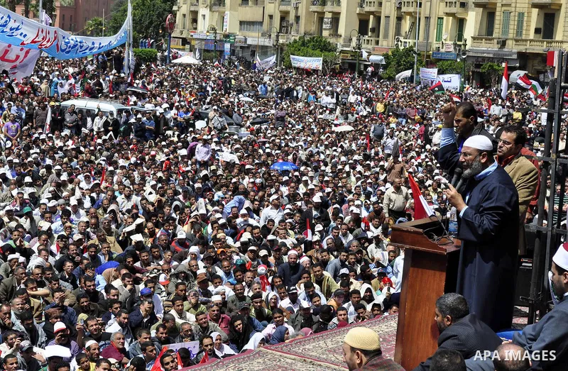 Egyptians perform Friday prayers as tens of thousands gathered for a demonstration at Cairo's Tahrir Square on April 8, 2011, two months after president Hosni Mubarak was ousted, to demand that former regime officials in...