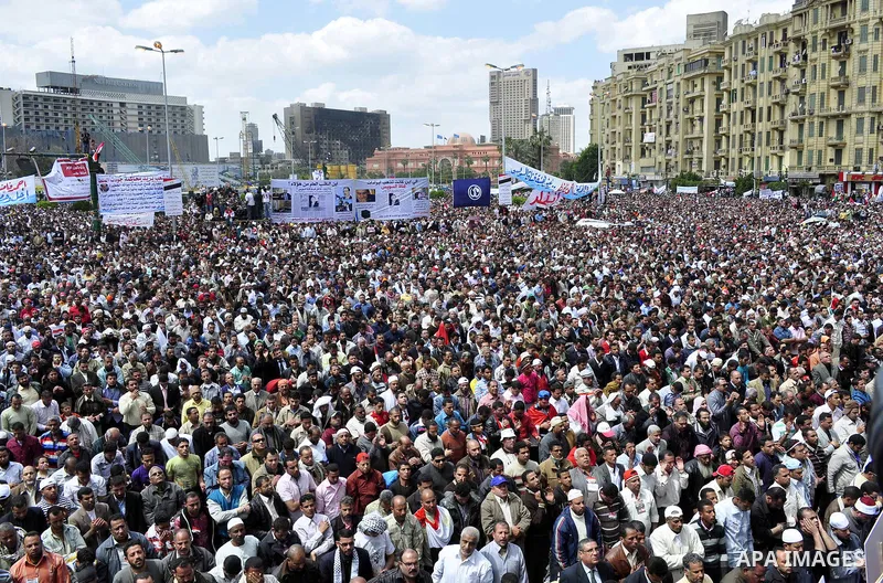 Egyptians perform Friday prayers as tens of thousands gathered for a demonstration at Cairo's Tahrir Square on April 8, 2011, two months after president Hosni Mubarak was ousted, to demand that former regime officials in...