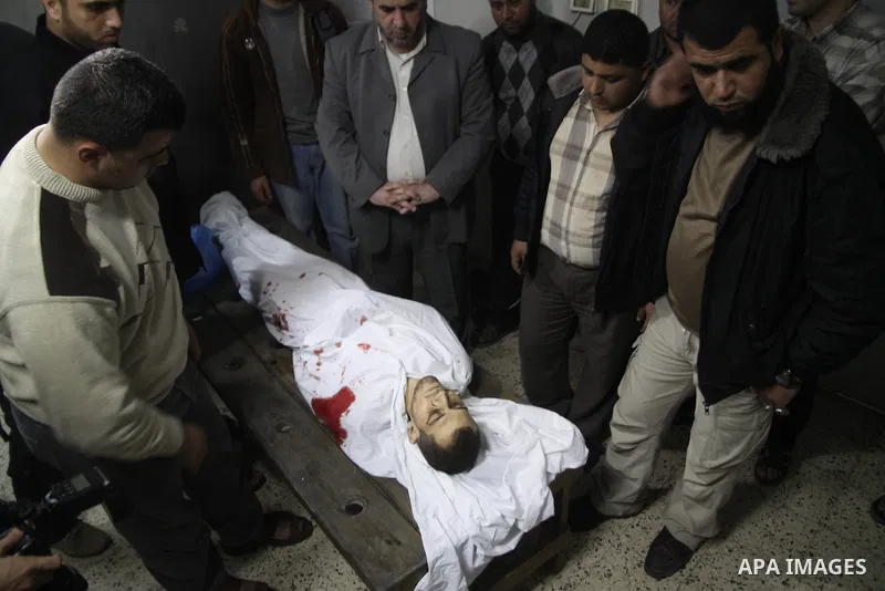 The body of a killed Palestinian Mohamed El-Araer, in a hospital mortuary after an Israeli airstrike in Gaza City on 08 April 2011 The air raids came a day after Gaza-based militants fired an attack-tank shell at an Isra...