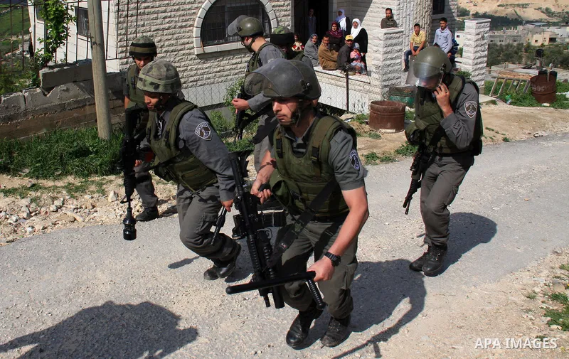 Israeli troops arrive to break up a scuffle between Jewish settlers and Palestinians in the West Bank village of Aseera, Saturday, April 9, 2011. Palestinian witnesses said about 40 settlers entered the village and scuff...