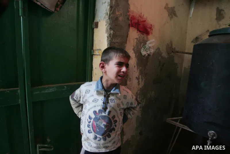 A relative of 10-year-old Palestinian boy Mahmud al-Jaro mourn during his funeral in Gaza City on April 9, 2011, a day after he was killed by Israeli shelling as the Israeli army pounded the Gaza Strip while militants fi...
