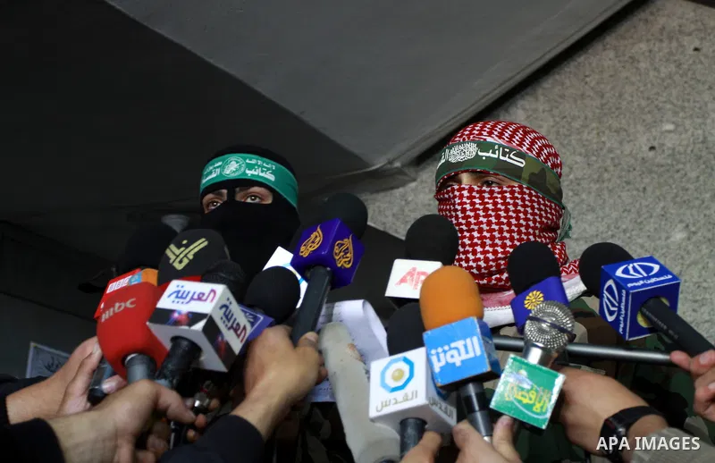The spokesman of Ezzedine al-Qassam Brigade, the military wing of the Palestinian Islamist movement Hamas which rules Gaza, Abo Obeda gives a press conference in Gaza City on April 9, 2011, as Israeli tank fire killed a...