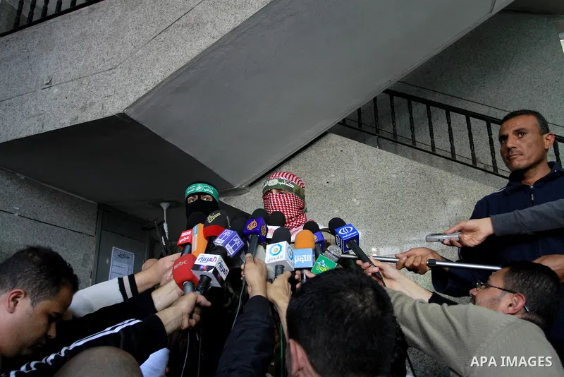 The spokesman of Ezzedine al-Qassam Brigade, the military wing of the Palestinian Islamist movement Hamas which rules Gaza, Abo Obeda gives a press conference in Gaza City on April 9, 2011, as Israeli tank fire killed a...