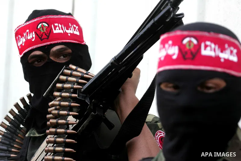 Palestinian militants of the National Resistance Brigades, the military wing of the Democratic Front for the Liberation of Palestine (DFLP), attend a news conference in the central Gaza City, 10 April 2011. Israel will c...