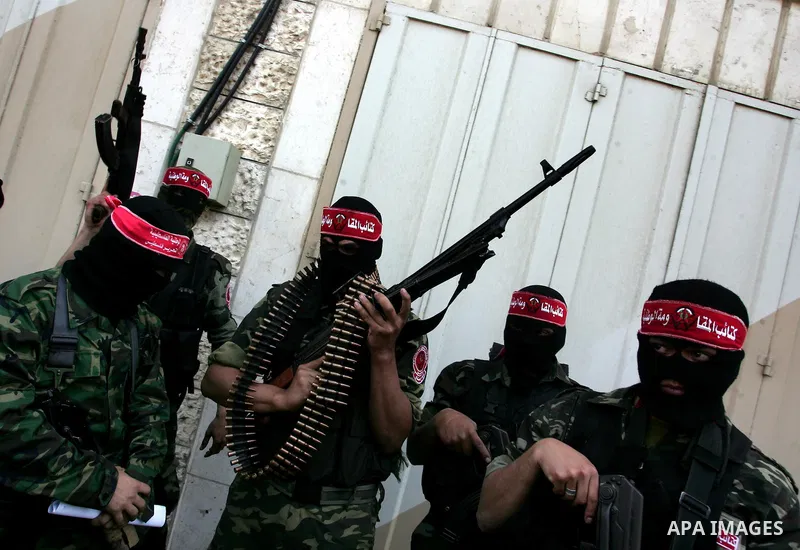 Palestinian militants of the National Resistance Brigades, the military wing of the Democratic Front for the Liberation of Palestine (DFLP), attend a news conference in the central Gaza City, 10 April 2011. Israel will c...