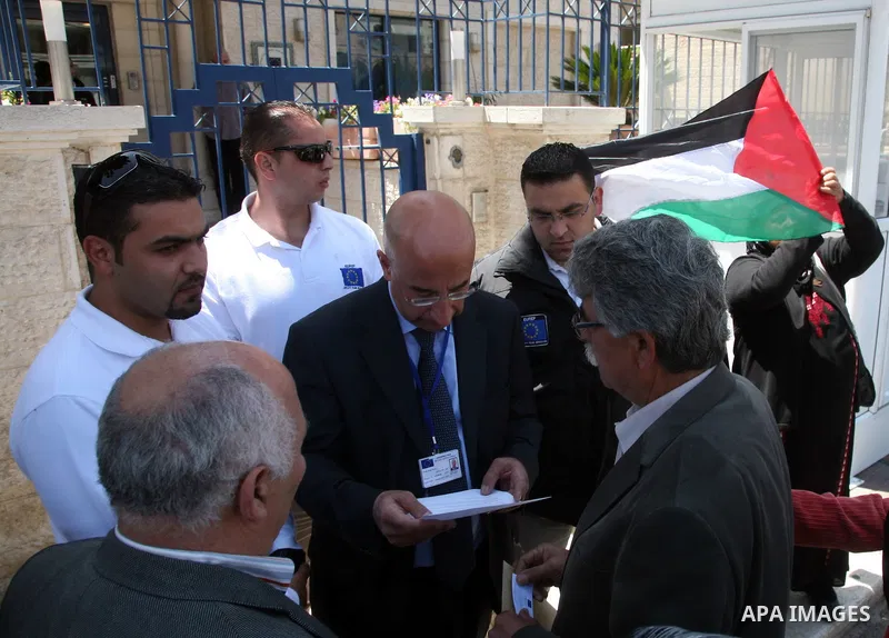 Palestinian take part in a protest in front of the European Commission in the French Hill in Jerusalem on the ongoing attacks on the Gaza Strip on April 11 2011.Photo by Sliman Khader