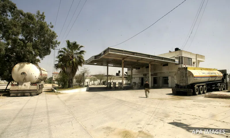 A Palestinian man walks past a closed natural gas station in Rafah, southern Gaza Strip on April 11,2011, as Gaza Strip suffers from the shortage of natural gas which enter to enclave Strip from Israel . Photo by Abed Ra...