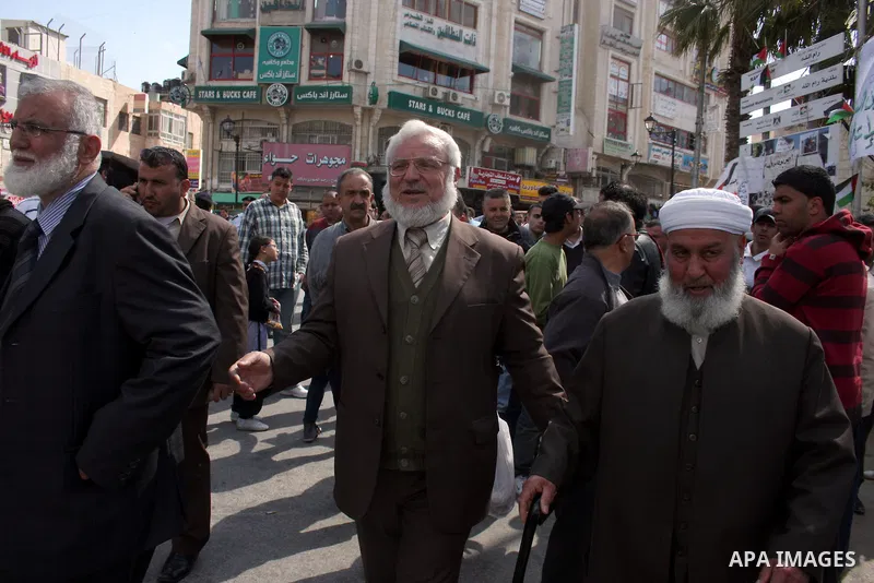 Aziz Duweik the speaker of the Hamas-dominated Palestinian parliament and Palestinian Hamas Legislative Council members, take part in a protest in the West Bank city of Ramallah on April 11,2011, calling the Palestinian...