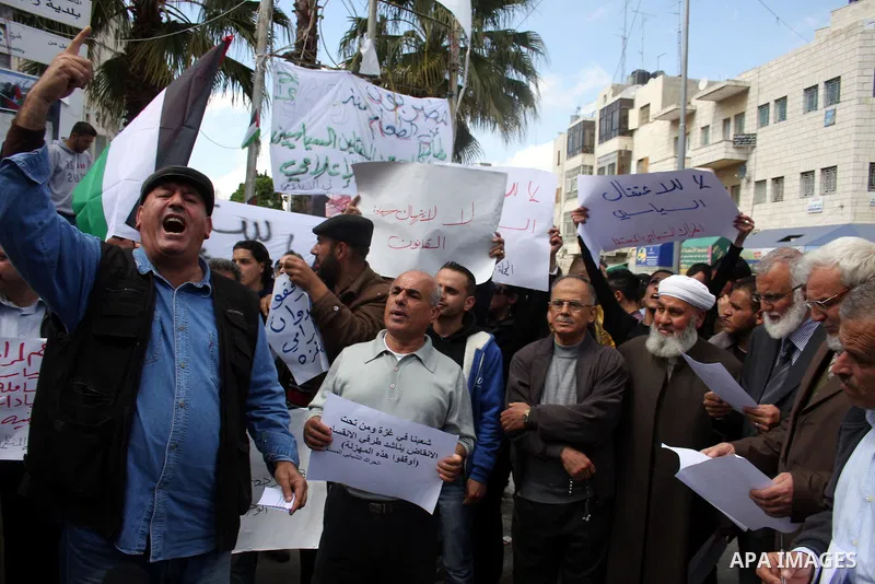 Aziz Duweik the speaker of the Hamas-dominated Palestinian parliament and Palestinian Hamas Legislative Council members, take part in a protest in the West Bank city of Ramallah on April 11,2011, calling the Palestinian...