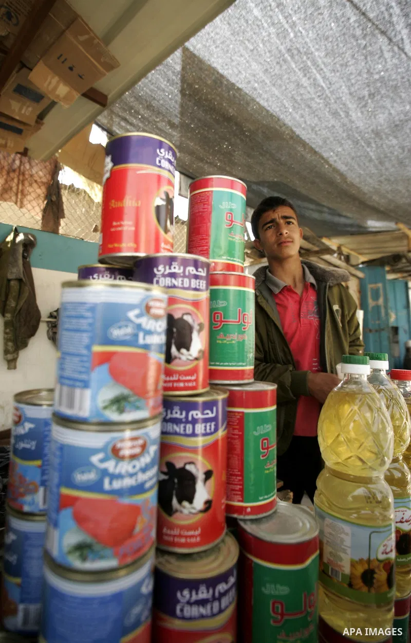 A Palestinian vendor sit at his shop in Rafah, southern Gaza Strip on April 11,2011. A shortage in basic goods in Gaza during the first quarter of 2011 due to continued Israeli preventing to enter most of the materials,...