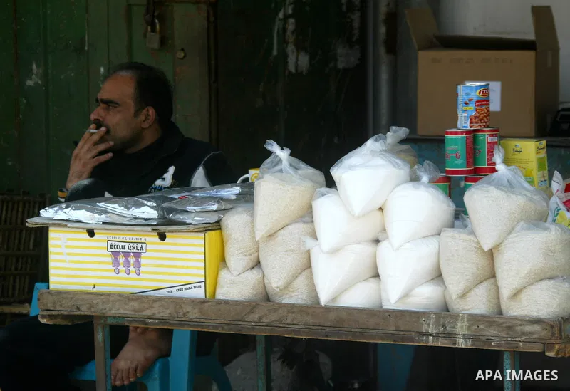 A Palestinian vendor sit at his shop in Rafah, southern Gaza Strip on April 11,2011. A shortage in basic goods in Gaza during the first quarter of 2011 due to continued Israeli preventing to enter most of the materials,...