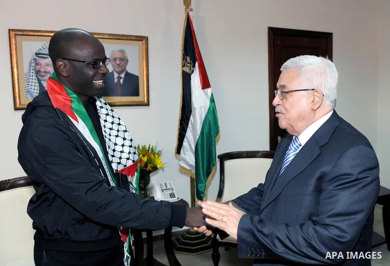 Palestinian President Mahmoud Abbas meets the Former French soccer player Lilian Thuram in the West Bank city of Ramallah April 12, 2011. Photo by Thaer Ganaim