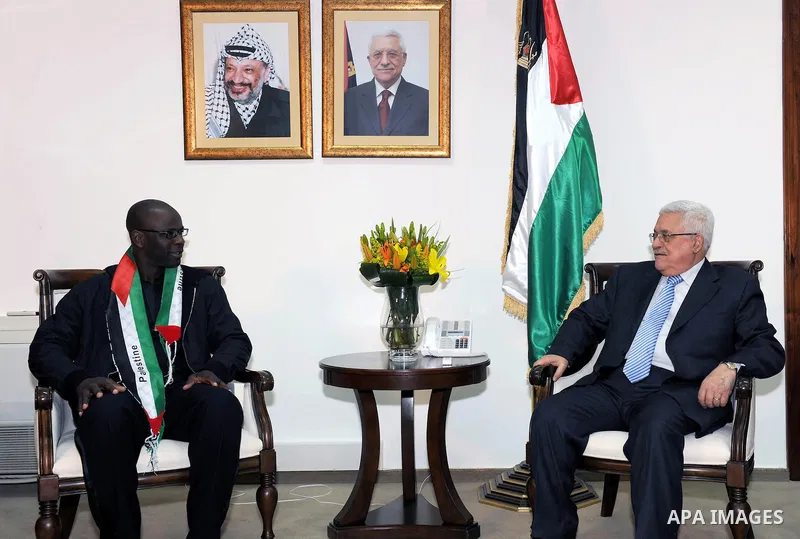 Palestinian President Mahmoud Abbas meets the Former French soccer player Lilian Thuram in the West Bank city of Ramallah April 12, 2011. Photo by Thaer Ganaim